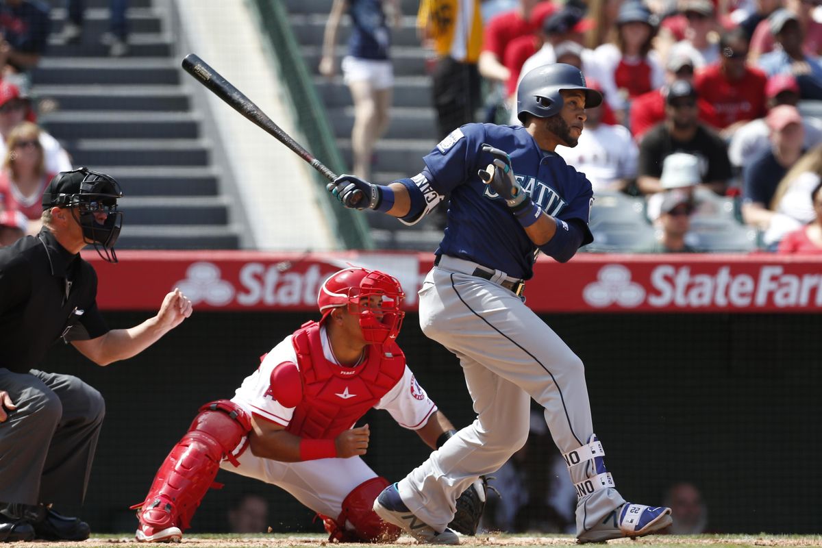 Seattle Mariners’ Robinson Cano hits a two-run double in the fifth inning of a baseball game against the Los Angeles Angels, Sunday, April 9, 2017, in Anaheim, Calif. (Christine Cotter / Associated Press)