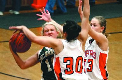 
Priest River's Amber Hirst, center, and Jamie Koch supply pressure on Sam Siron of St. Maries during Tuesday's district play. 
 (Bruce Twitchell Special to The S-R / The Spokesman-Review)