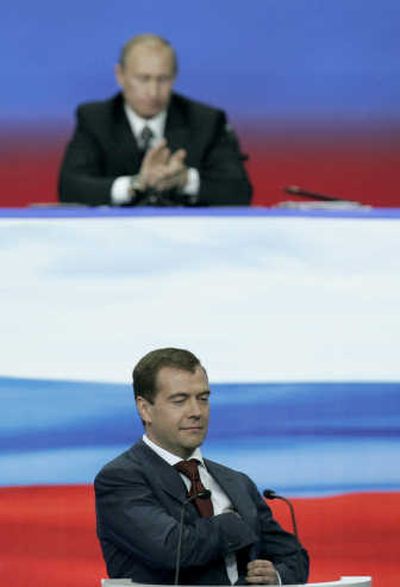 
With President Vladimir Putin in the background,  presidential nominee Dmitry Medvedev smiles during a United Russia party congress Monday in Moscow. Associated Press
 (Associated Press / The Spokesman-Review)