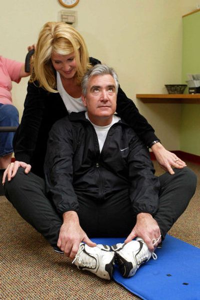 
There are many stretches that couples can do together as part of their fitness plan. 
 (File Photo / The Spokesman-Review)