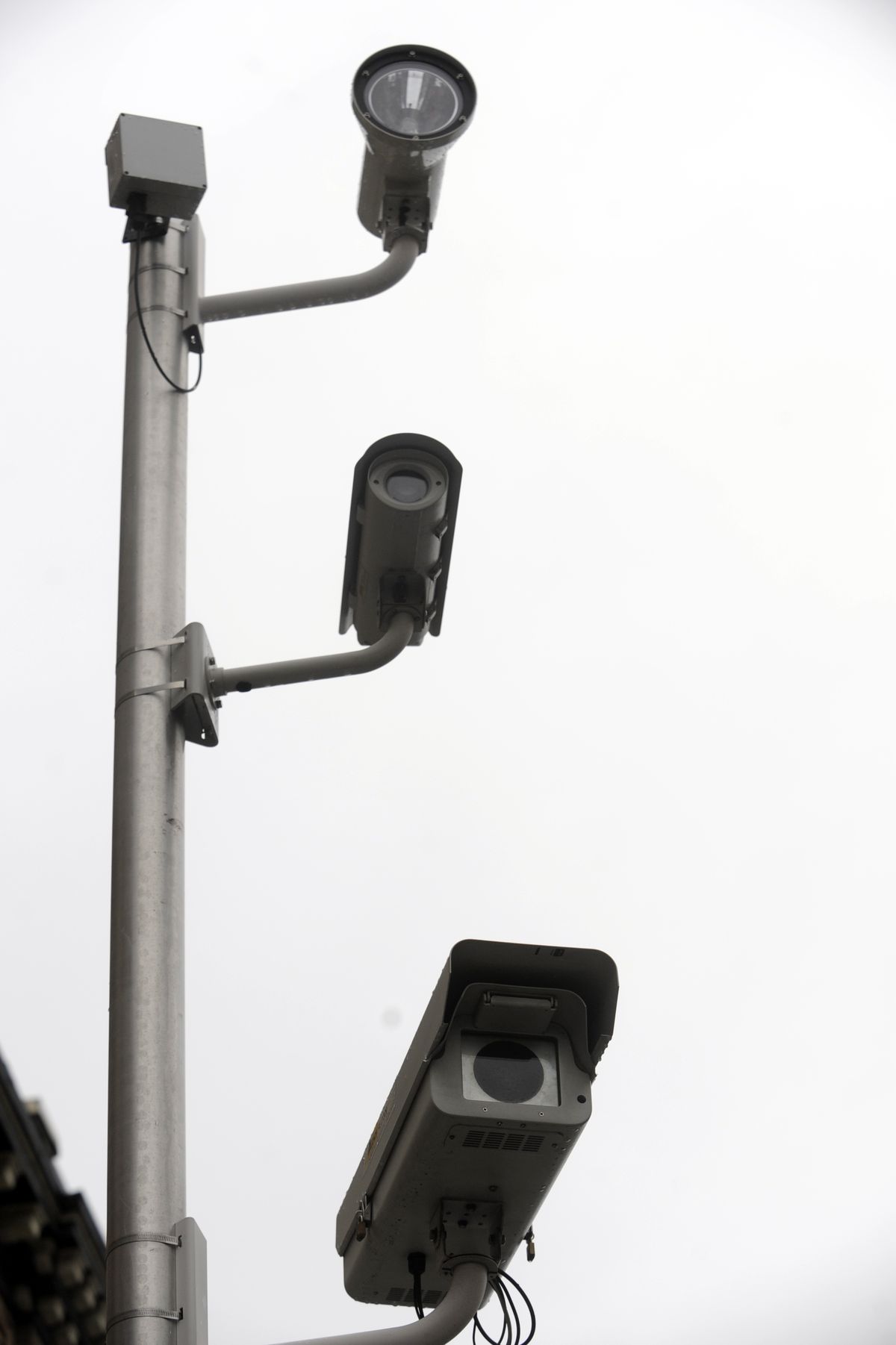 The red light camera system has a control box to monitor the roadway and uses two cameras to videotape and photograph red light runners.