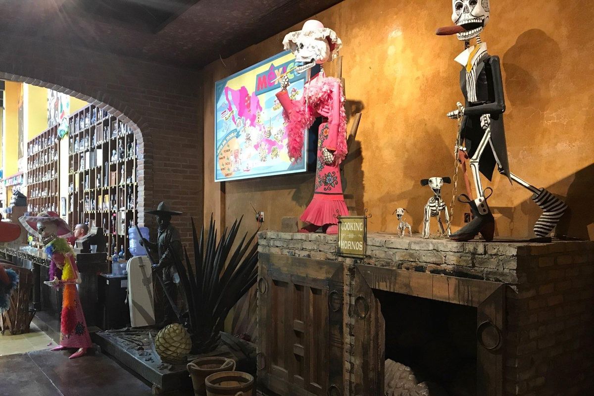The gift shop in Cabo San Lucas, Mexico, where Brandi Gallagher of Spokane received a punctured lung, shown Thursday. She stood atop the platform at right to get a picture between the two life-size Dia de los Muertos figurines, then fell into the spiky agave plant sculpture at left. (Debi Gallagher)