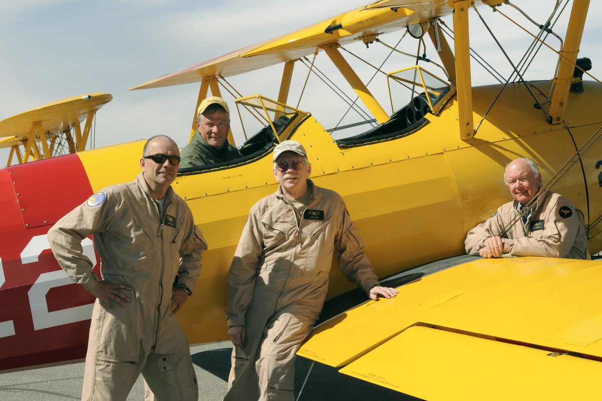 Stearman pilots, from left, Dave Holmes, James Love, top,  Larry Tobin and Jeff Hamilton, returned to Felts Field in Spokane. The pilots swept the national flying competition awards for “Four-Ship” formation flying and aerobatic competition at the 39th Annual National Stearman Fly-in last week in Galesburg, Ill.  (Dan Pelle)