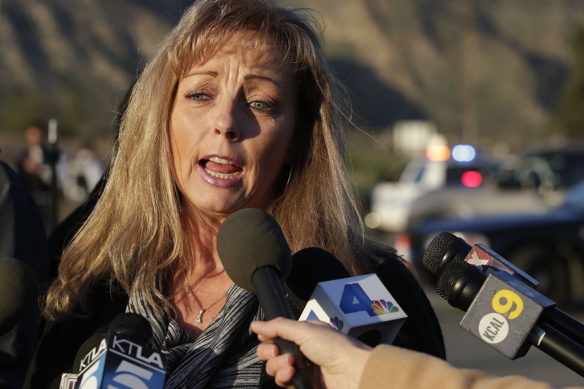 Cindy Bachman, Public Information officer for the San Bernardino County Sheriff's Department talks about the hunt for accused killer and fired Los Angeles police officer, Christopher Dorner in Yacaipa, Calif.,Tuesday, Feb. 12, 2013. (Chris Carlson / Associated Press)