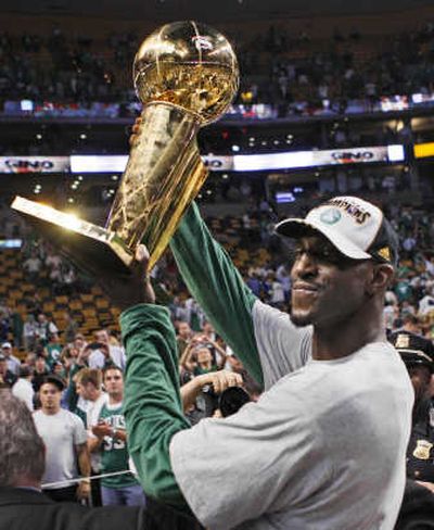 
Kevin Garnett, who scored 26 points, holds the NBA championship trophy. Associated Press
 (Associated Press / The Spokesman-Review)
