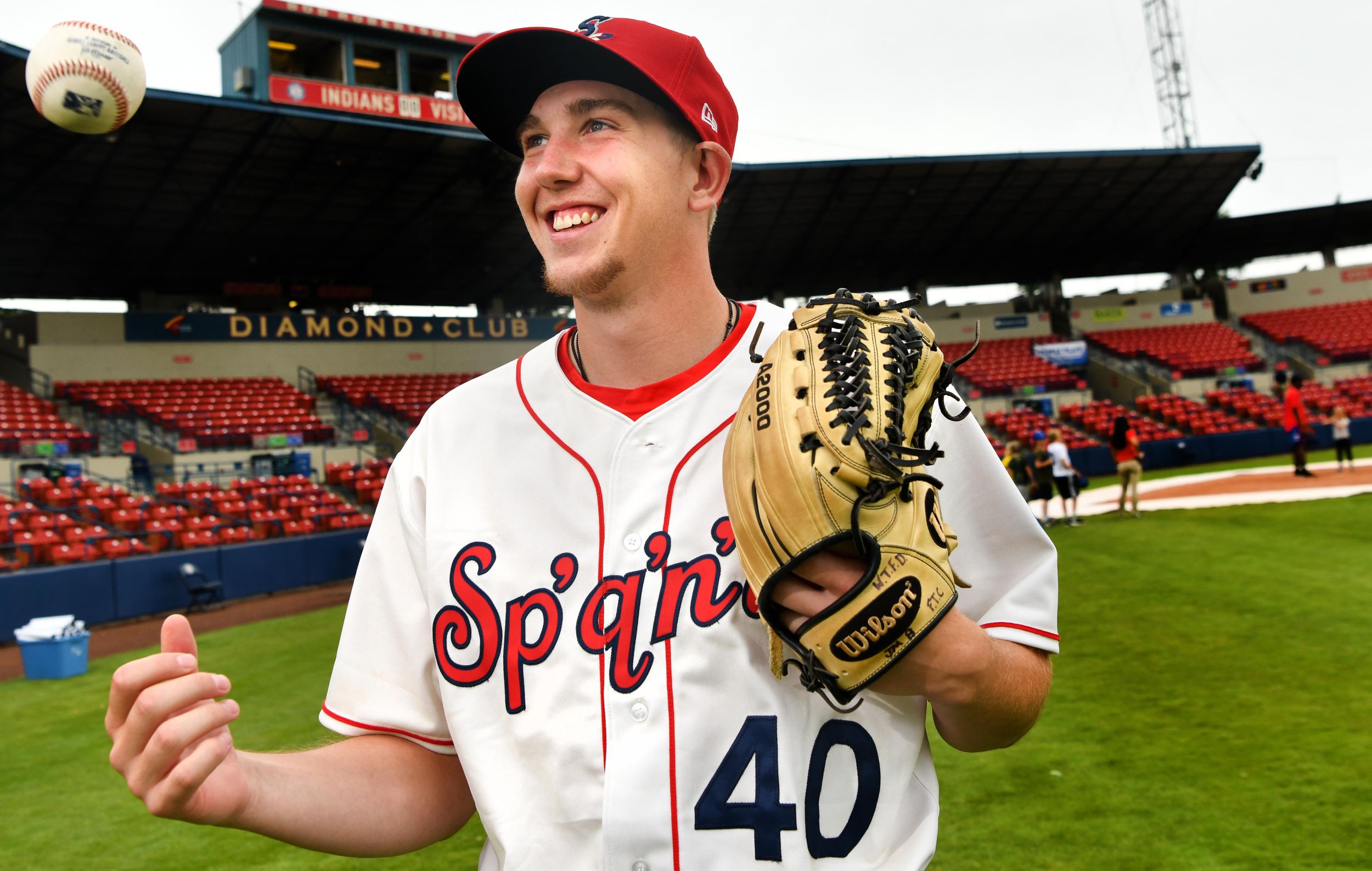 Down under Spokane Indians pitcher John Matthews comes at hitters from
