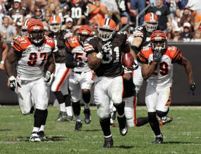 
Cleveland's Jamal Lewis ran for 216 yards, including this 66-yard scoring jaunt in the third quarter.Associated Press
 (Associated Press / The Spokesman-Review)