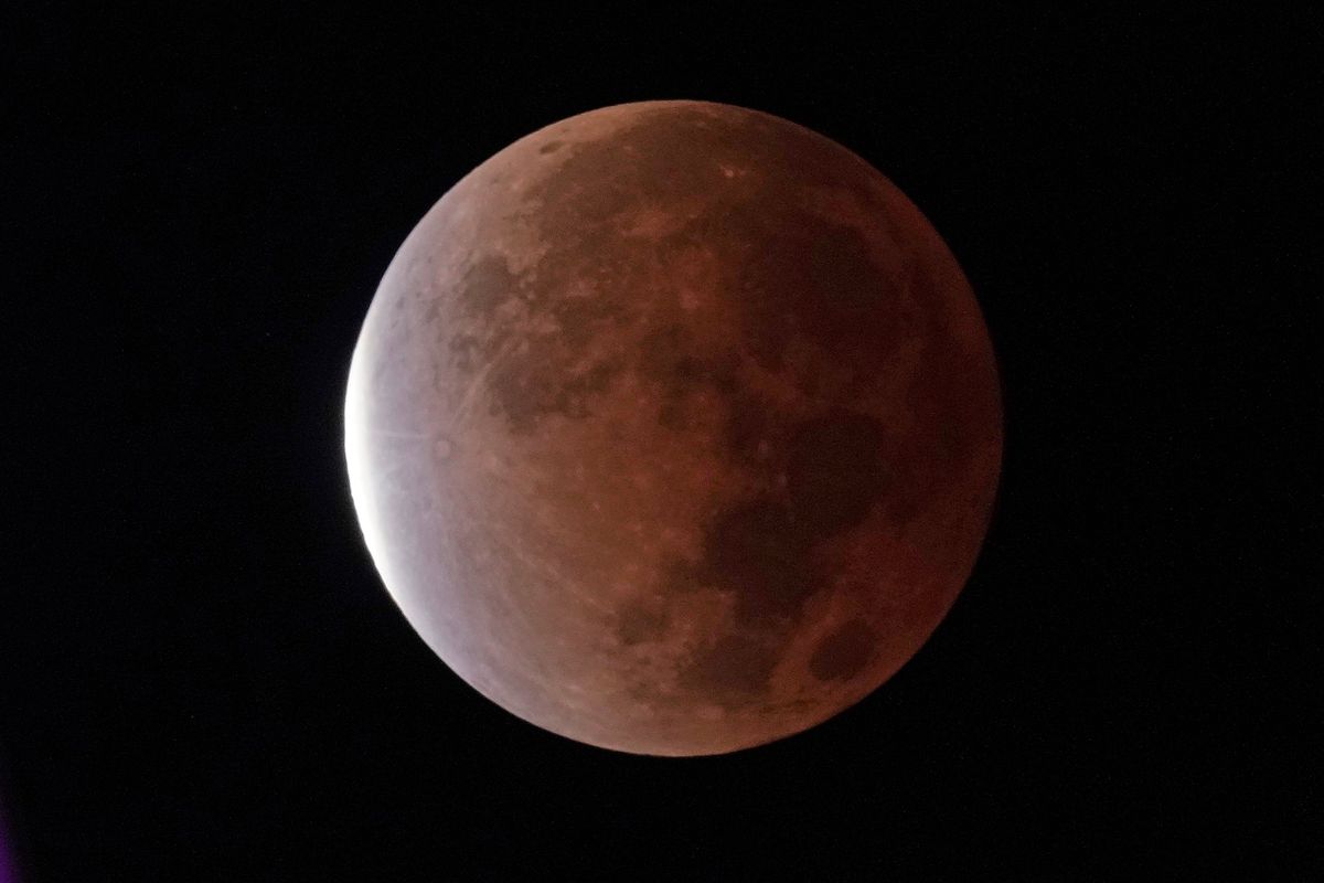 The earth’s shadow covers the moon during a partial lunar eclipse Friday in Kansas City, Mo. NASA and the nation’s top federal nuclear research lab put out a request for proposals for a fission surface power system.  (Charlie Riedel)