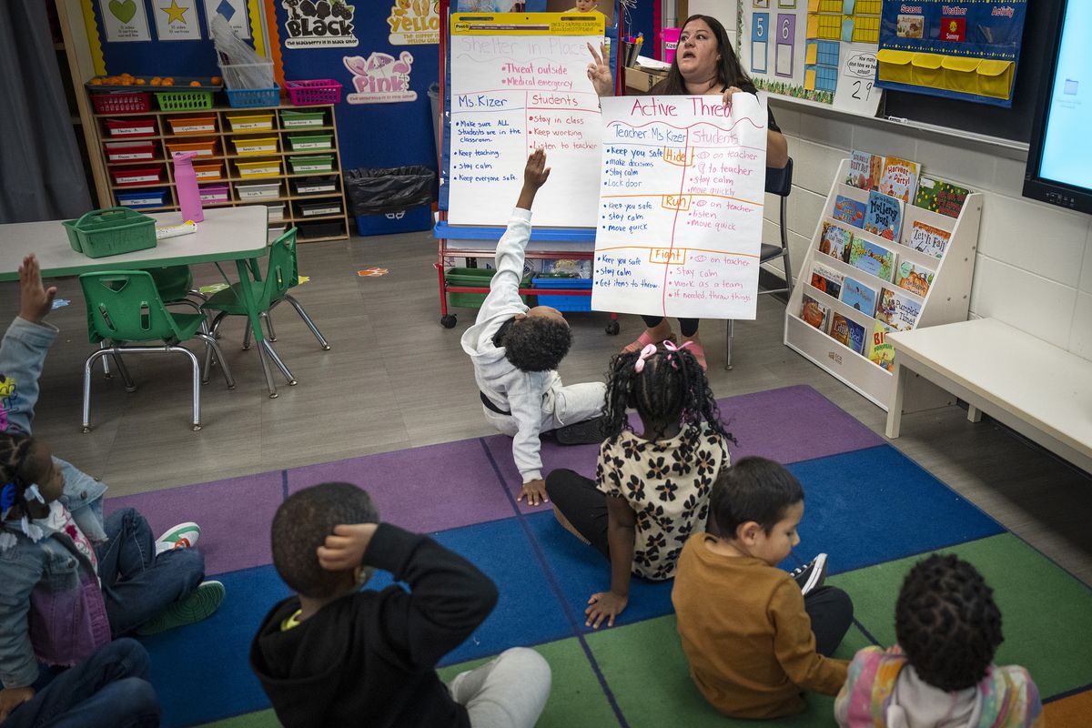 Kindergarten teacher Nicole Kizer goes over the lockdown drills with her students on Oct. 20 at Talahi Community School in St. Cloud, Minn.  (Leila Navidi/Minnesota Star Tribune)