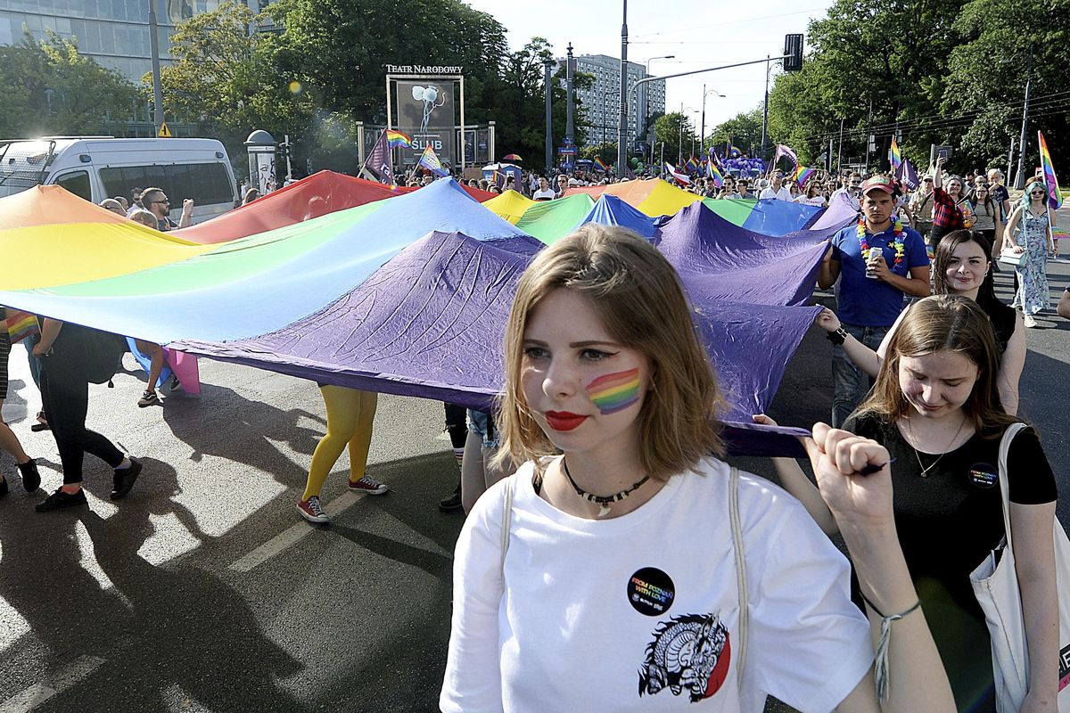 People take part in the annual Gay Pride parade Saturday, June 9, 2018, in Warsaw, Poland. LGBT activists say they have to fight for their rights harder under the current conservative government in Poland. The pride celebrations come as LGBT activists say a conservative turn in Poland is only motivating them to fight harder for their rights, even though their hopes of seeing same-sex marriage legalized has no chance now in the country. (Czarek Sokolowski / AP)