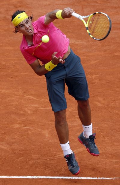Rafael Nadal faces a hurdle in defending his Wimbledon title.  (Associated Press / The Spokesman-Review)