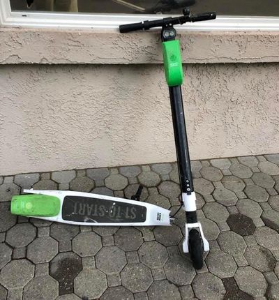 A Lime scooter is pictured broken in half. (Courtesy of Peter Holley/Washington Post)