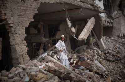 A man stands in the middle of the rubble of his house destroyed in an airstrike in Sultanwas village,  Pakistan, on Wednesday.  (Associated Press / The Spokesman-Review)