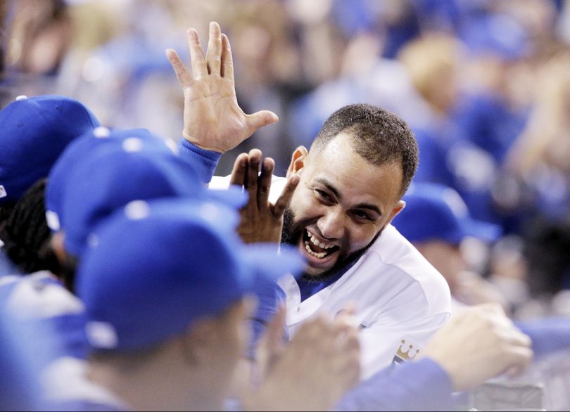 Kansas City Royals' Kendrys Morales celebrates Mike Moustakas's home run against the Toronto Blue Jays during the second inning in Game 6 of baseball's American League Championship Series on Friday, Oct. 23, 2015, in Kansas City, Mo. (Charlie Riedel / Associated Press)