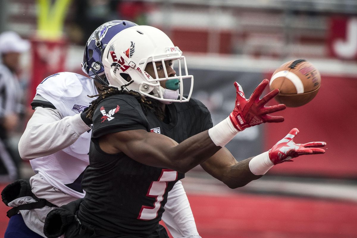 Eastern Washington wide receiver Nsimba Webster  hauls in a long reception from Eastern Washington quarterback Gage Gubrud  during  on Nov. 4, 2017, in Cheney. (Colin Mulvany / The Spokesman-Review)