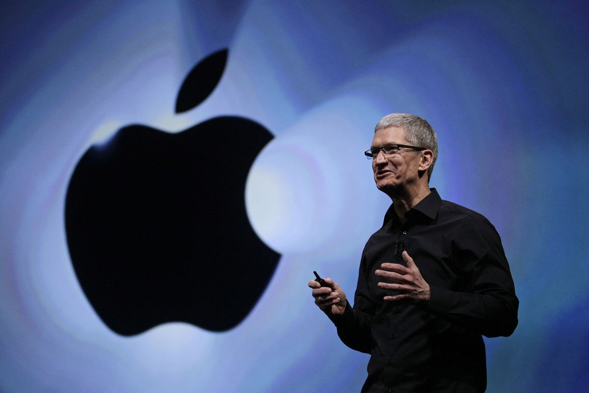 FILE - In this Wednesday, Sept. 12, 2012, file photo, Apple CEO Tim Cook speaks following an introduction of the new iPhone 5 in San Francisco. Apple is emerging as a gentler, cuddlier corporate citizen in the year after the death of CEO and co-founder Steve Jobs. CEO Tim Cook