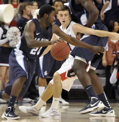 Gonzaga guard David Stockton, center, gets screened, allowing San DIego's Cameron Miles, left, to drive past in the first half of WCC action Saturday, Jan. 21, 2012 at the McCarthey Athletic Center at Gonzaga University. (Jesse Tinsley / The Spokesman-Review)