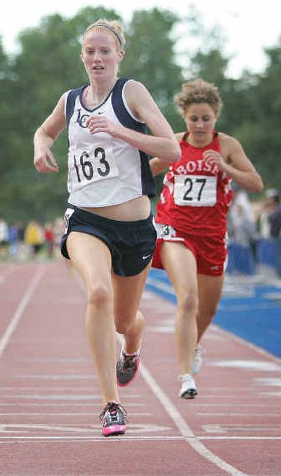 
Lake City's Breanna Sande crosses the finish line to defend her 5A 1,600-meter title Friday in Boise. She also won the 800.
 (Associated Press / The Spokesman-Review)