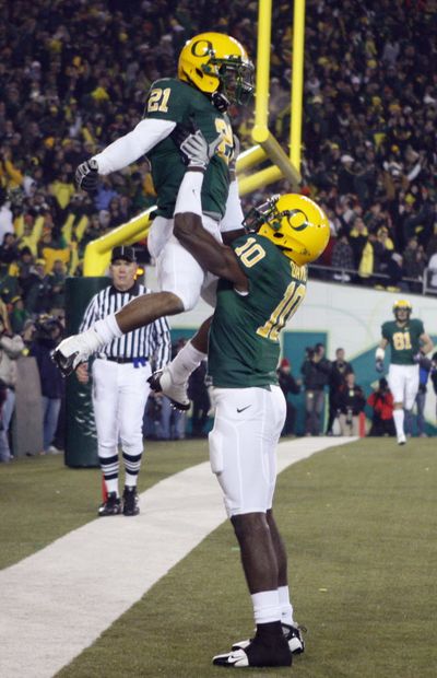 Oregon's LaMichael James (21) celebrates with teammate D.J. Davis (10) after scoring against  Oregon State in the second quarter during the annual Civil War game in Eugene tonight.  (Rick Bowmer / The Associated Press)