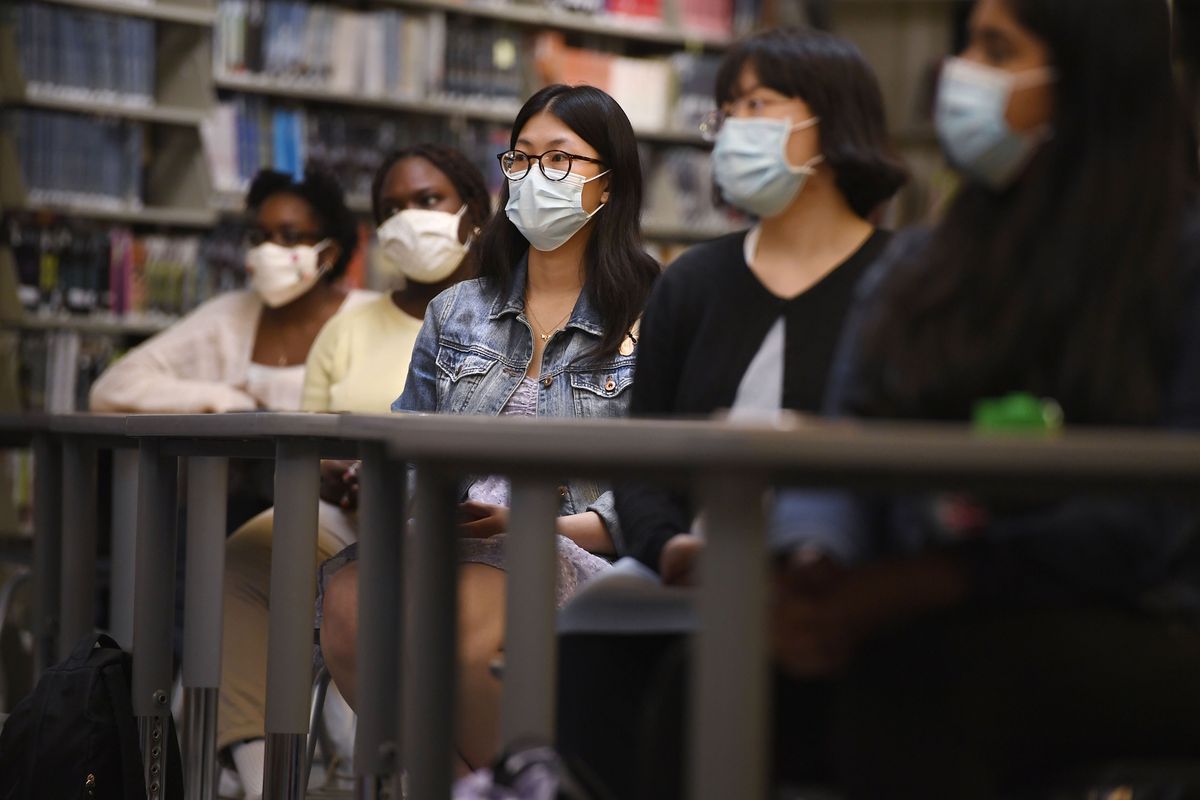 Senior Annie Chen, center, listens with classmates as Connecticut Attorney General William Tong speaks for Asian Pacific American Heritage Month on May 10 at Farmington High School in Farmington, Conn. The year of anti-Asian violence has led students and teachers to advocate for reexamining how Asian American studies and history are taught in public schools.  (Jessica Hill)
