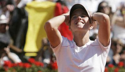 
Belgium's Justine Henin-Hardenne reacts as she defeats Russia's Svetlana Kuznetsova in the women's final at the French Open. 
 (Associated Press / The Spokesman-Review)