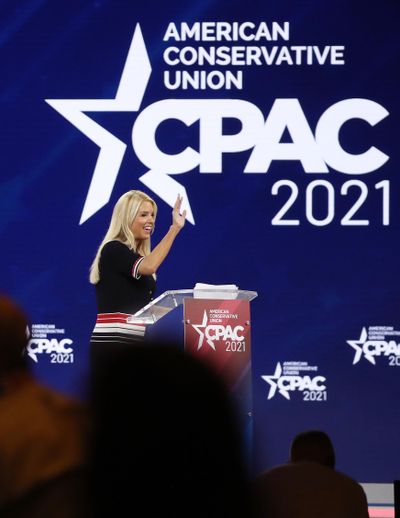 Former Florida attorney general Pam Bondi waves to a cheering crowd at CPAC at the Hyatt Regency in Orlando on February 26, 2021. Bondi is President-elect Donald Trump's nominee for attorney general.  (Stephen M. Dowell/Orlando Sentinel/TNS)