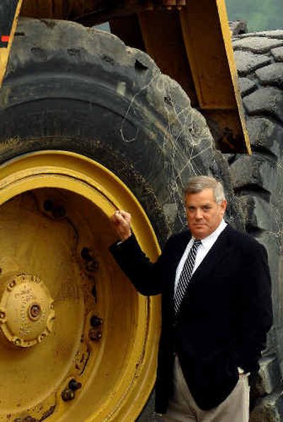 
Walker Machinery president Steve Walker stands beside a used Caterpillar 777D loader outside of Walker-Cat headquarters in Belle, W.Va.. Mammoth tires for heavy equipment, which can cost up to $30,000 apiece, are in short supply worldwide. 
 (Associated Press / The Spokesman-Review)