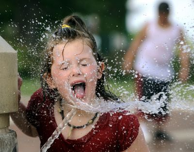 ORG XMIT: ILPEO101 Sierra Rawson, 5,  of Canton, Ill., drinks from a fountain at the Gateway Building on the riverfront in Peoria, Ill., on Tuesday, June 16, 2009. (AP Photo/Peoria Journal Star, Ron Johnson) (Ron Johnson / The Spokesman-Review)