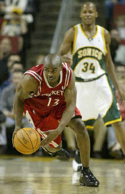 
Mike James of Houston breaks downcourt in the first quarter, leaving Seattle's Ray Allen in his dust. 
 (Associated Press / The Spokesman-Review)