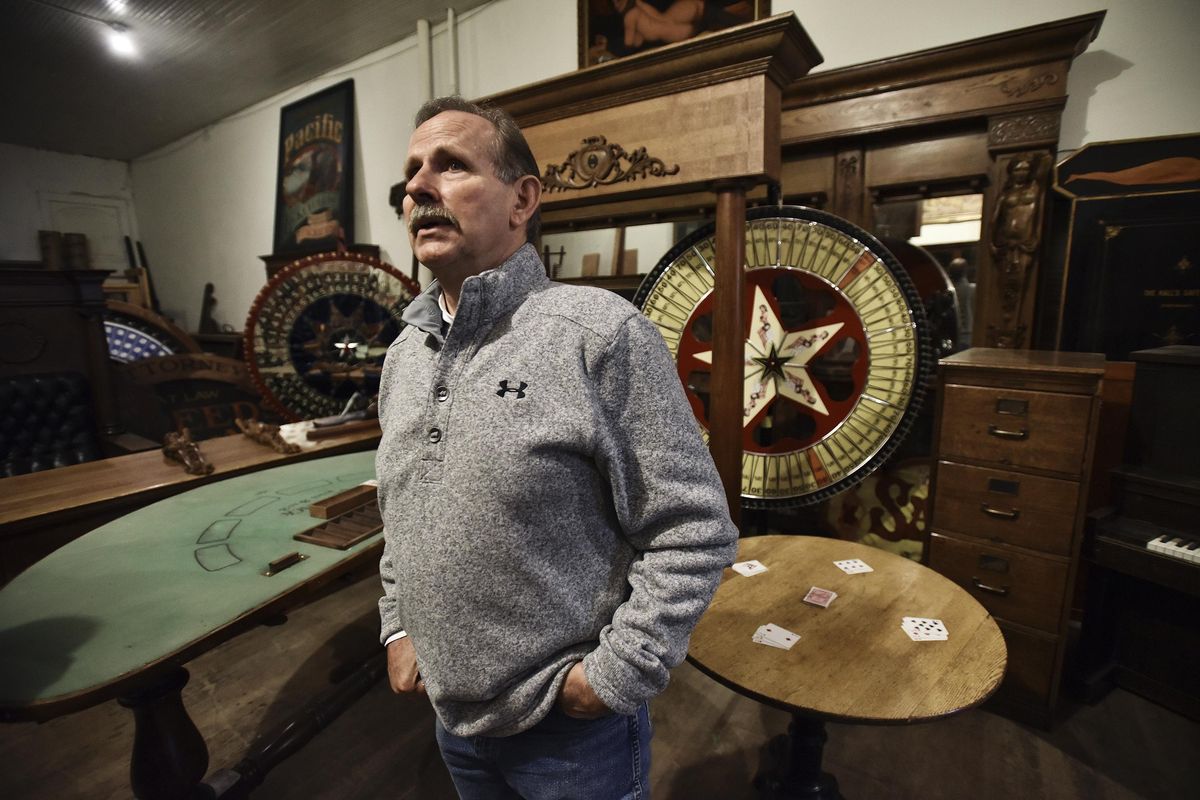Parley Pearce stands in a room full of antique items he has collected from bars and brothels throughout the Western United States in the Oak Hotel, a former brothel, on Nov. 14 in Pendleton, Ore. Pearce, the co-owner of the Hamley complex of restaurants and stores, wants to restore the Oak Hotel to its former glory – minus the illicit activity. ( (E.J. Harris / East Oregonian)