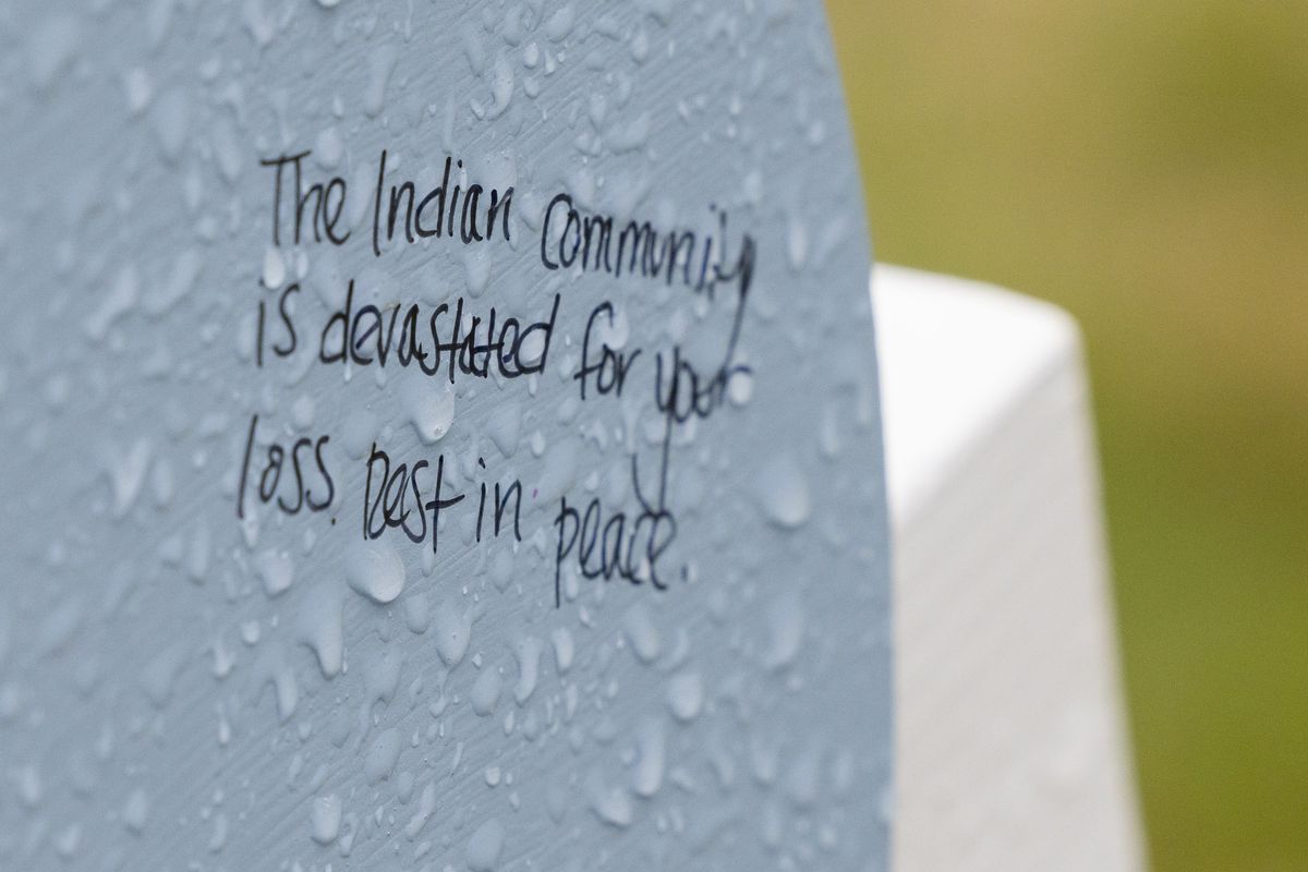 A message saying, "The Indian community is devastated for your loss. Rest in peace," on the cross for Aishwarya Thatikonda at the memorial outside the mall honoring the victims of a mass shooting at Allen Premium Outlets in Allen on Monday, May 8, 2023. A gunman fatally shot eight people and wounded seven others Saturday at the mall before being killed by a police officer.   (Tribune News Service)