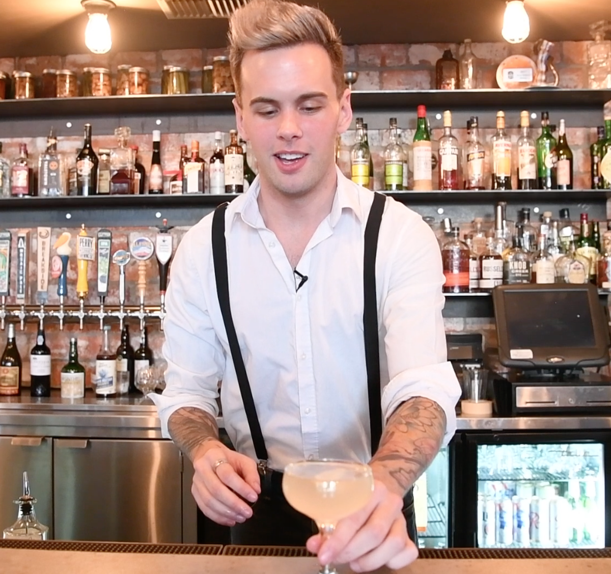 Bartender Cody Winfrey makes an original drink called Coming Up Roses at Casper Fry in the Perry District. (Jesse Tinsley / The Spokesman-Review)