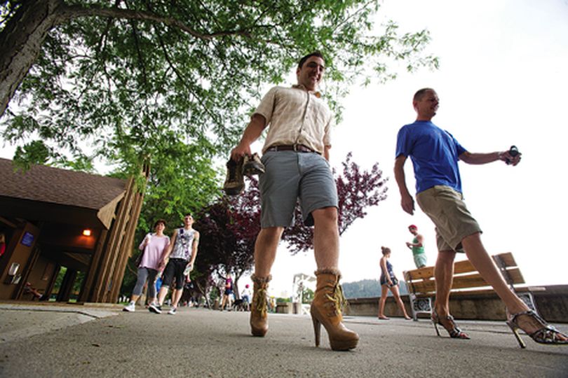 Brian Keenan, left, and Tim Wilson strut their stuff through City Park in Coeur d'Alene on Saturday morning during 