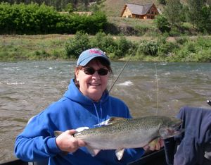 Evelyn Kaide, who’s operated The Guide Shop in Orofino for 20 years, takes time off to land a spring chinook salmon on Clearwater River.
