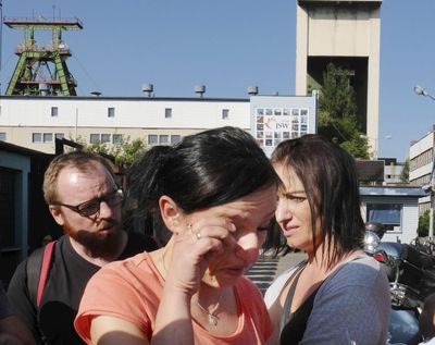 A woman crying in front of the Zofiowka coal mine in Jastrzebie-Zdroj in southern Poland, on Saturday, May 5, 2018, after miners were reported missing following a powerful tremor at the mine. (Rafal Klimkiewicz / Associated Press)