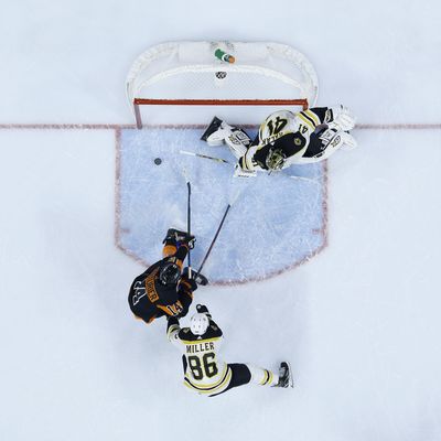 Philadelphia Flyers’ Sean Couturier (14) scores a goal past Boston Bruins’ Jaroslav Halak (41) and Kevan Miller (86) during the second period of an NHL hockey game, Wednesday, Jan. 16, 2019, in Philadelphia. (Matt Slocum / Associated Press)