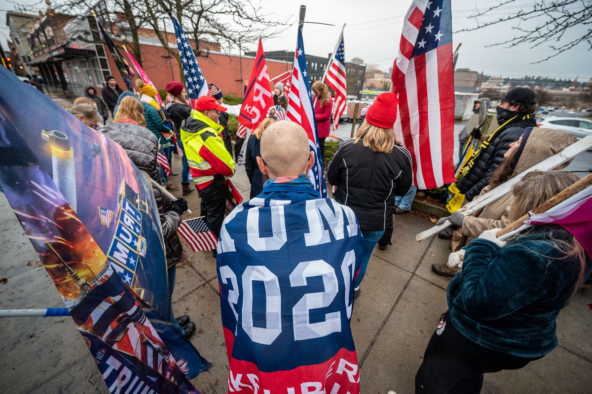 Trump supporters hold a prayer circle at the end of the Save the Republic, Stop the Steal rally, Wed., Jan. 6, 2021, on West Broadway across from the Spokane County Courthouse.  (COLIN MULVANY/THE SPOKESMAN-REVIEW)