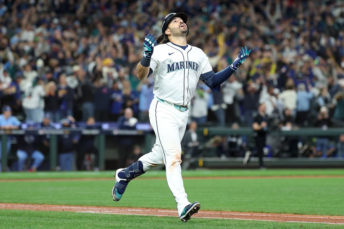 Seattle Mariners third baseman Eugenio Suárez hits a go-ahead home run in the eighth inning against the Toronto Blue Jays during Game 5 of the ALCS on Friday at T-Mobile Park in Seattle.  (Getty Images)