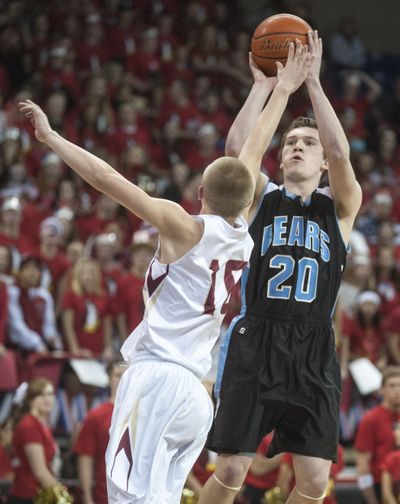Central Valley’s Austin Rehkow shoots over University’s Michael Isotalo. (Colin Mulvany)