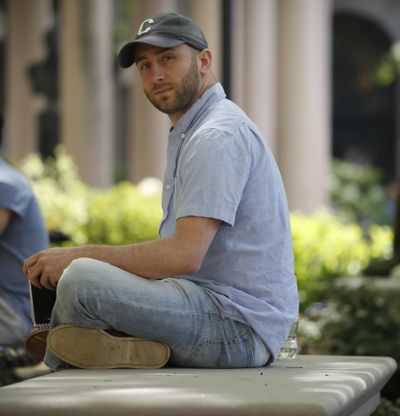 Iraq War veteran Kristofer Goldsmith poses for a photo May 9, 2018, at a campus park after his last final exam of the semester at Columbia University in New York. Military veterans with less-than-honorable discharges from the military say they often can’t get jobs, and they hope a recent warning to employers by the state of Connecticut will change that. Goldsmith says that for veterans with “bad paper,” their service record looks more like a criminal record to potential employers. (Bebeto Matthews / Associated Press)