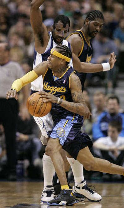 
Denver Nuggets guard Allen Iverson attempts to get around Dallas Mavericks guard Greg Buckner during Saturday's game. 
 (Associated Press / The Spokesman-Review)