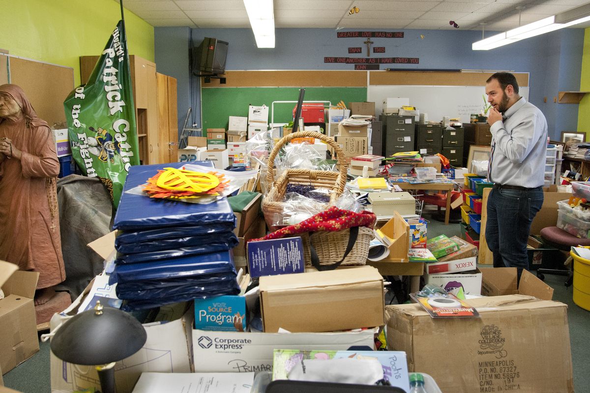 Travis Franklin, director of the Spokane International Academy, views a room filled with items left behind in the old St. Patrick’s School in Spokane. Spokane International Academy is the second charter school approved in Spokane. (Dan Pelle)
