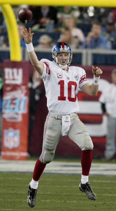 
Eli Manning made what seemed impossible come to fruition on Sunday. Associated Press
 (Associated Press / The Spokesman-Review)