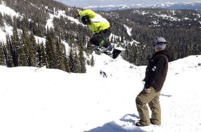 
Mark Harris watches as Axton Vorpahl executes a frontside 720 at the half pipe at Schweitzer Mountain Resort on Sunday. Harris' local efforts have resulted in national opportunities for himself and local athletes. 
 (J. Bart Rayniak / The Spokesman-Review)