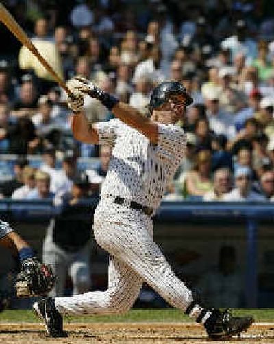
Tino Martinez, who has homered in seven of his last eight starts, belts the latest on Wednesday. 
 (Associated Press / The Spokesman-Review)