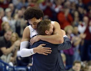 Elias Harris is welcomed to the bench for his final time at McCarthey by Mark Few. (Dan Pelle)
