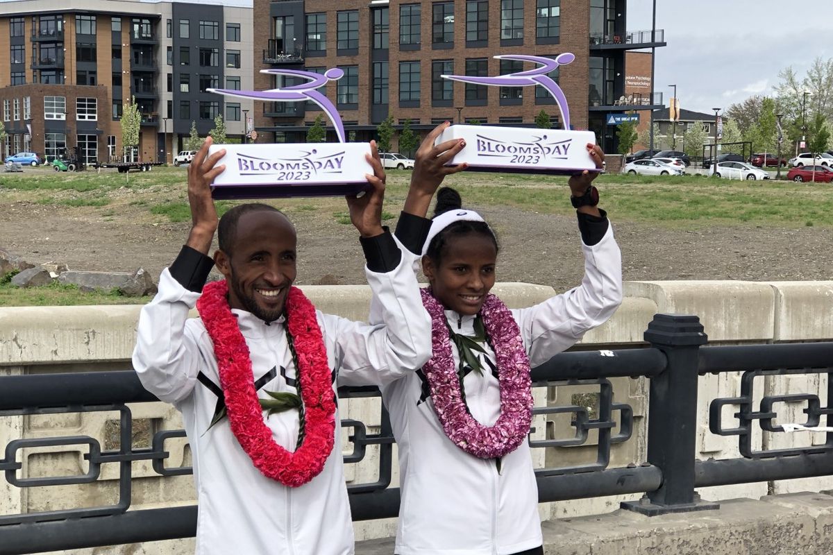 Elite Bloomsday winners Jemal Yimer (left) and Yeshi Kalayu pose with trophies on Sunday, May 7, 2023.   (Dave Nichols)
