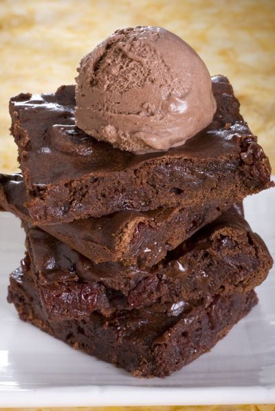 Consider serving Dark Chocolate Brownies with Sour Cherries  with a scoop of low-fat ice cream.  (Associated Press)