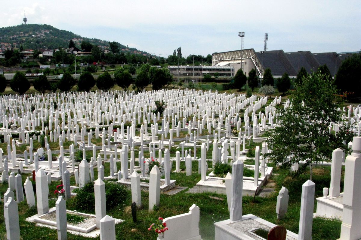 The Olympic venues that once lined a park-like valley in Sarajevo are now surrounded by gravestones of those who died in the city in the 1990s, as seen in this June 2012 photo. Attacks from the hills took the lives of 11,000 people, and in Bosnia more than 100,000 people were killed. (Jesse Tinsley)