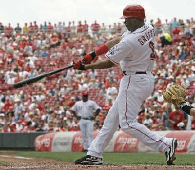 
Cincinnati Reds' Ken Griffey Jr. has cemented a seat in the Hall of Fame. Here, he hits a two-run home run in the second inning of a baseball game, Thursday, May 10, in Cincinnati.
 (AP / The Spokesman-Review)